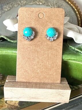 Turquoise Colored stud earrings with a halo setting